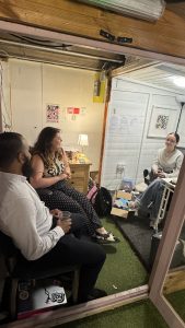 Mysa mentor chatting with open door staff in the sheds